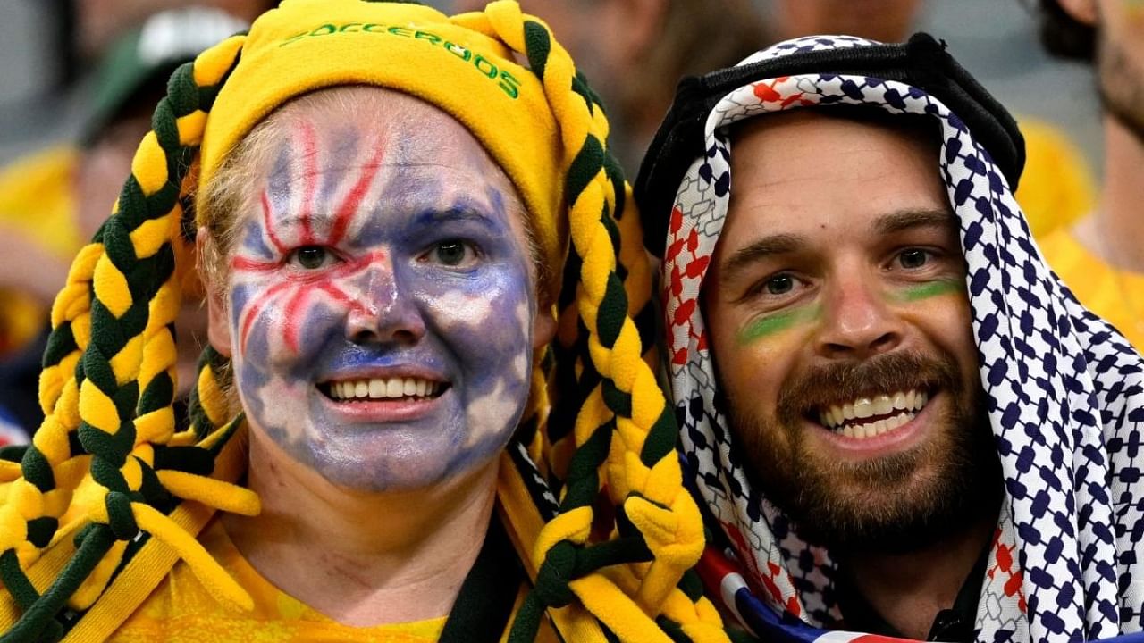 Australia supporters pose ahead of the start of the Qatar 2022 World Cup round of 16 football match between Argentina and Australia at the Ahmad Bin Ali Stadium in Al-Rayyan, west of Doha on December 3, 2022. Credit: AFP Photo