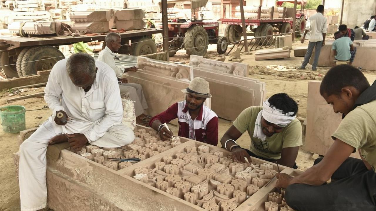 Workers prepare stones for the construction of Shri Ram Janmbhoomi temple, at a workshop in Ayodhya. credit: PTI File Photo