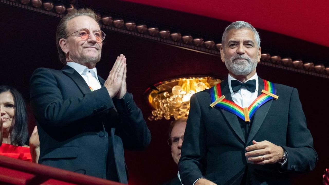 Kennedy Center honorees US actor George Clooney and musician Bono of Irish rock band U2 arrive at the Kennedy Center Honors at the Kennedy Center in Washington, DC. Credit: AFP Photo