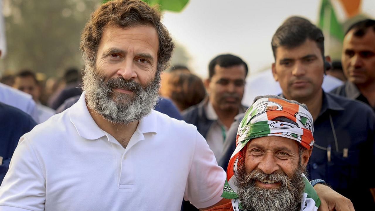 Congress leader Rahul Gandhi with a supporter during the party's 'Bharat Jodo Yatra', in Jhalawar district. Credit: PTI Photo