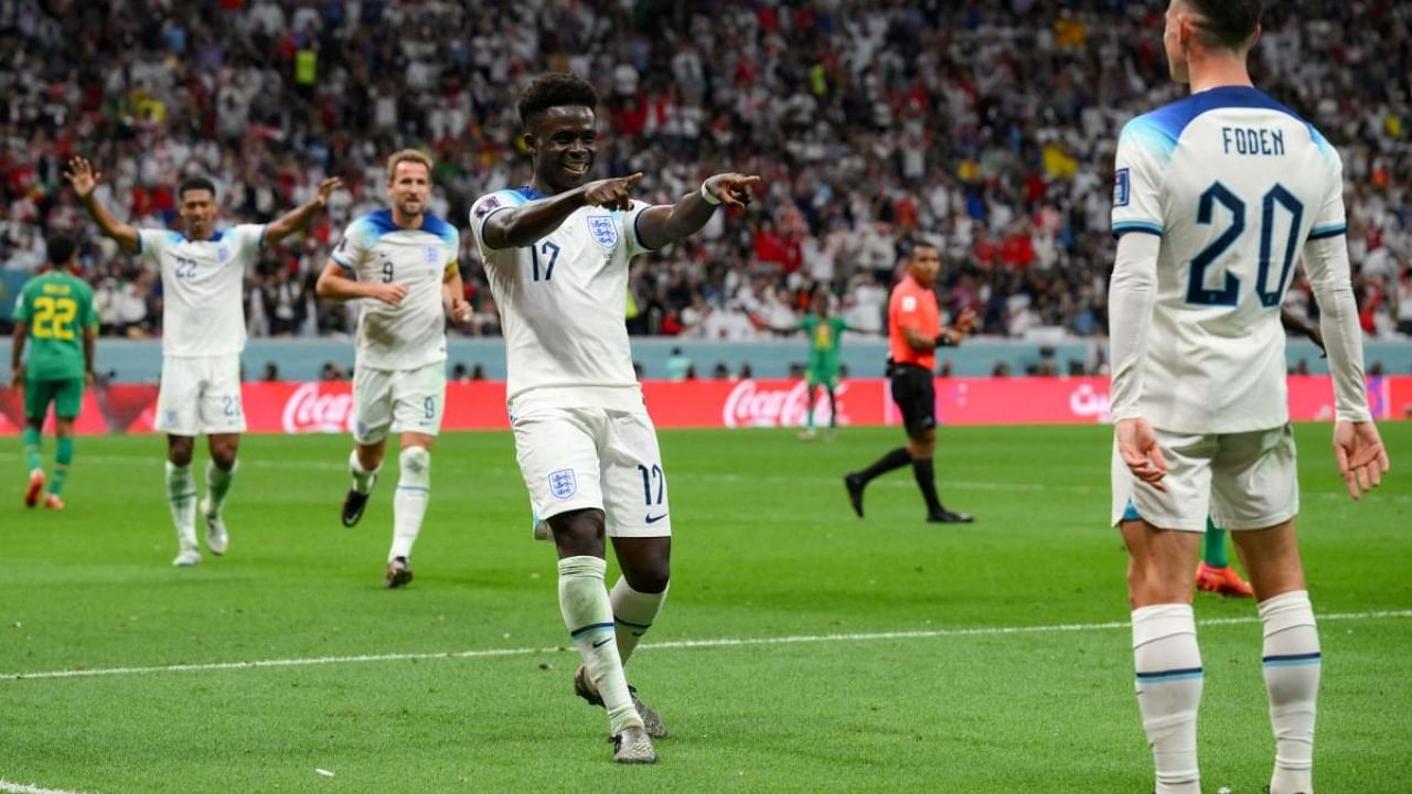 England celebrates the third goal against Senegal. Credit: AFP Photo