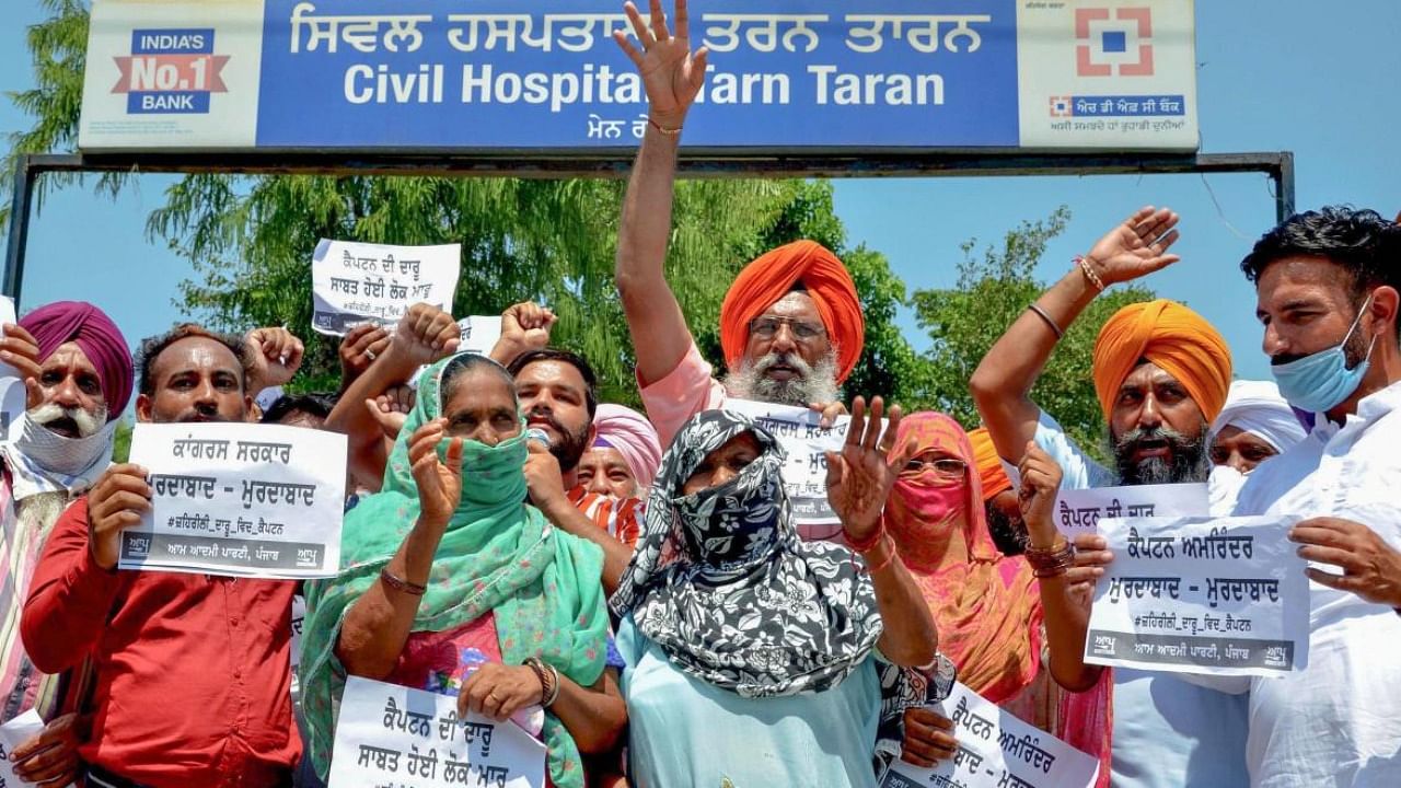 Locals protest over death of people after allegedly consuming spurious liquor in Tarn Taran, Punjab. Credit: PTI File Photo