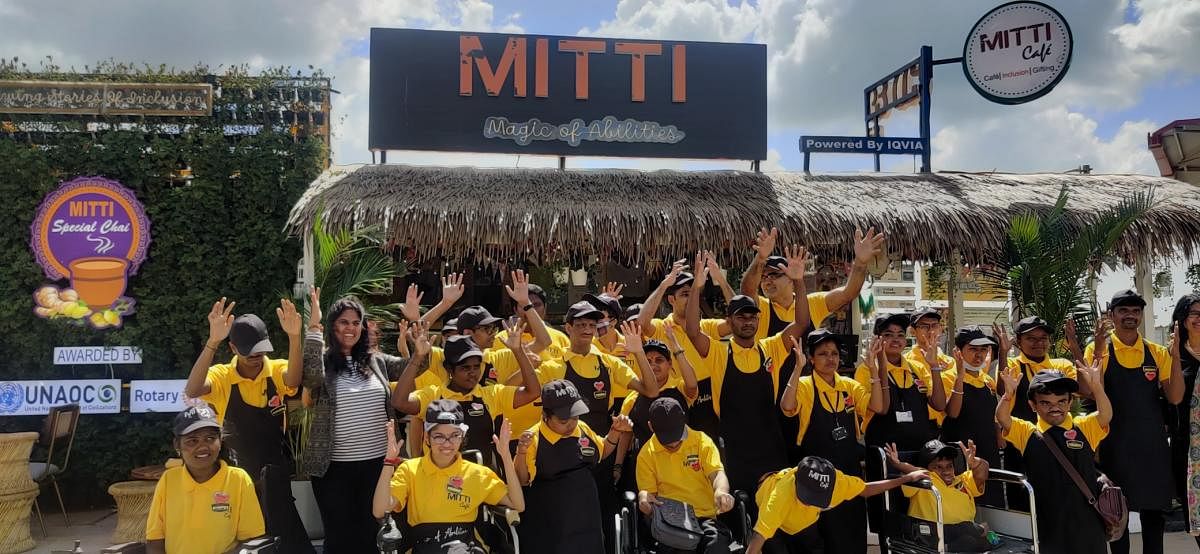 Staff celebrate the opening of Mitti Café on KIA premises. Credit: DH Photo