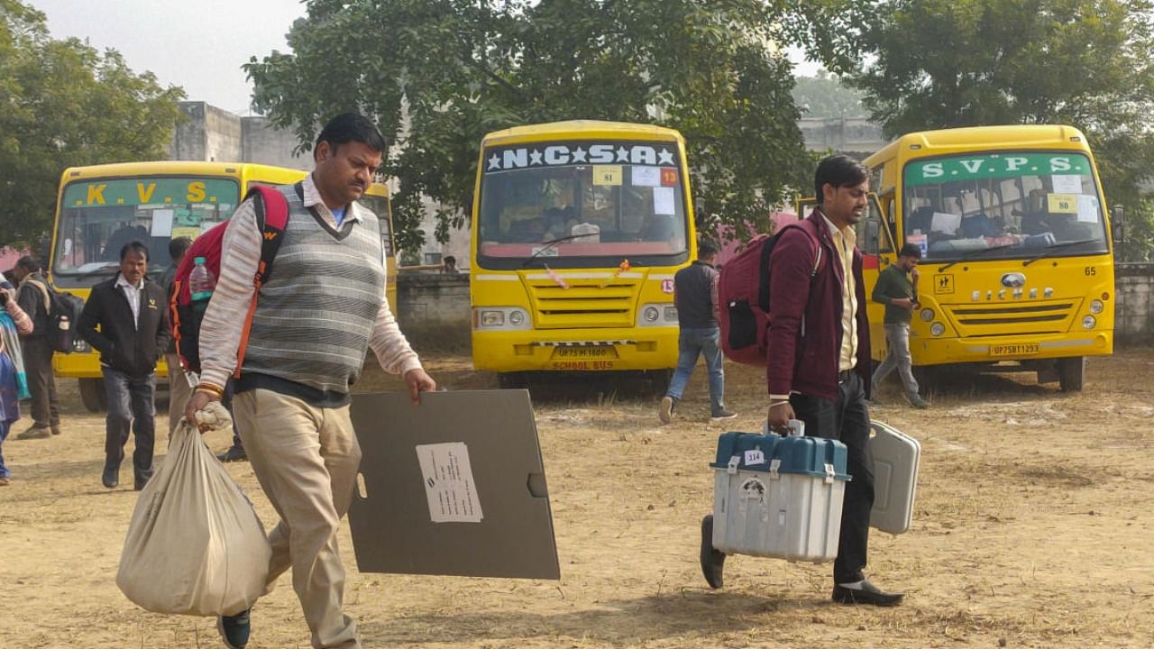 Polling parties leave for election duty on the eve of Mainpuri Assembly bypoll, in Etawah. Credit: PTI Photo