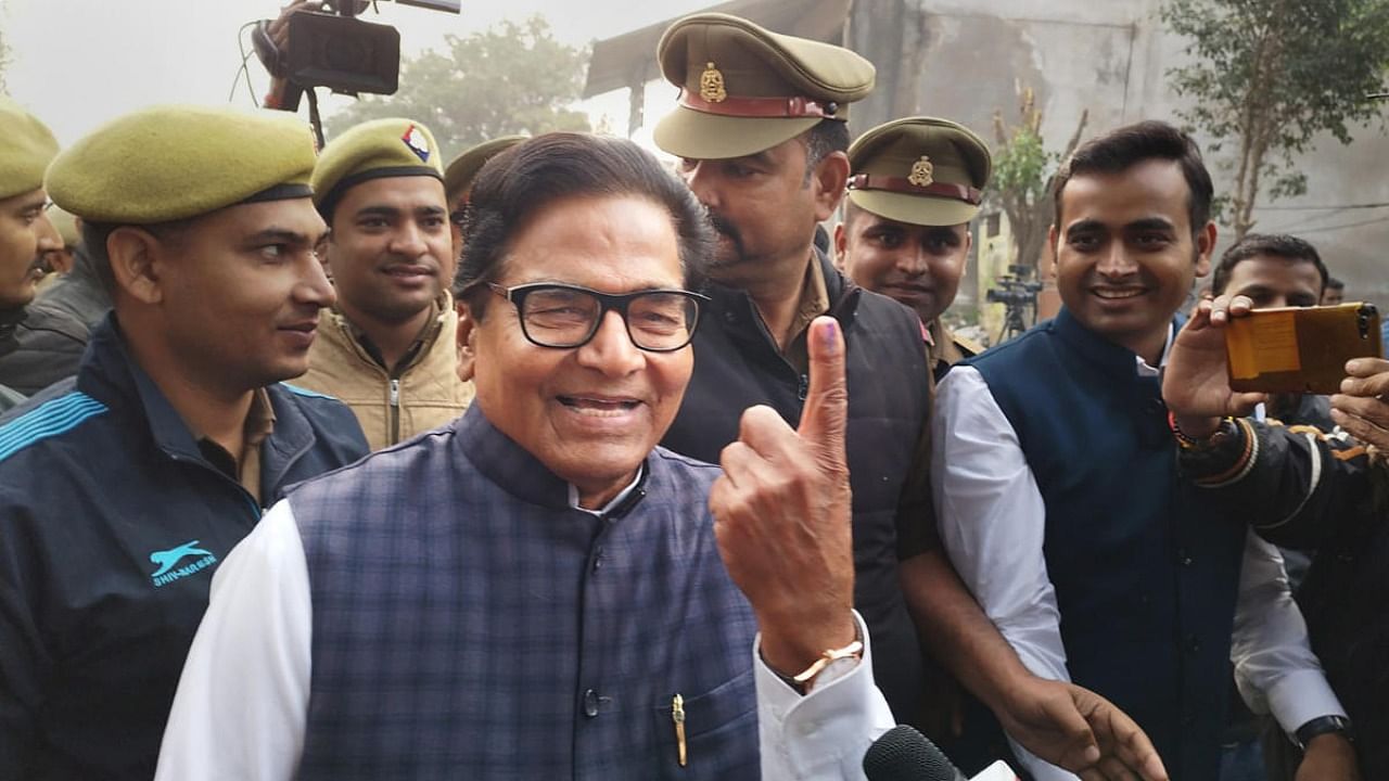 Samajwadi Party MP Ram Gopal Yadav shows his finger marked with indelible ink after casting his vote at a polling booth during the Mainpuri Lok Sabha seat by-elections, at Saifai in Etawah district, Monday, Dec. 5, 2022. Credit: PTI Photo