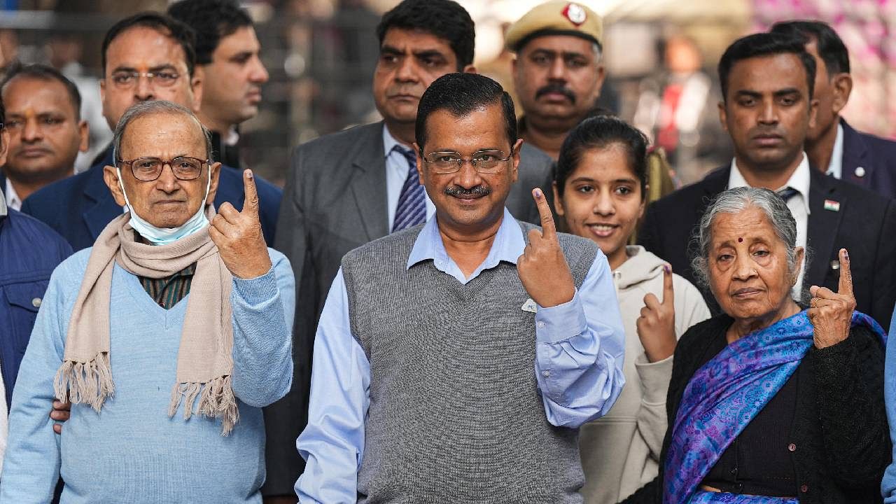 Delhi Chief Minister and AAP Convener Arvind Kejriwal with his family members after casting votes for the MCD elections. Credit: PTI Photo