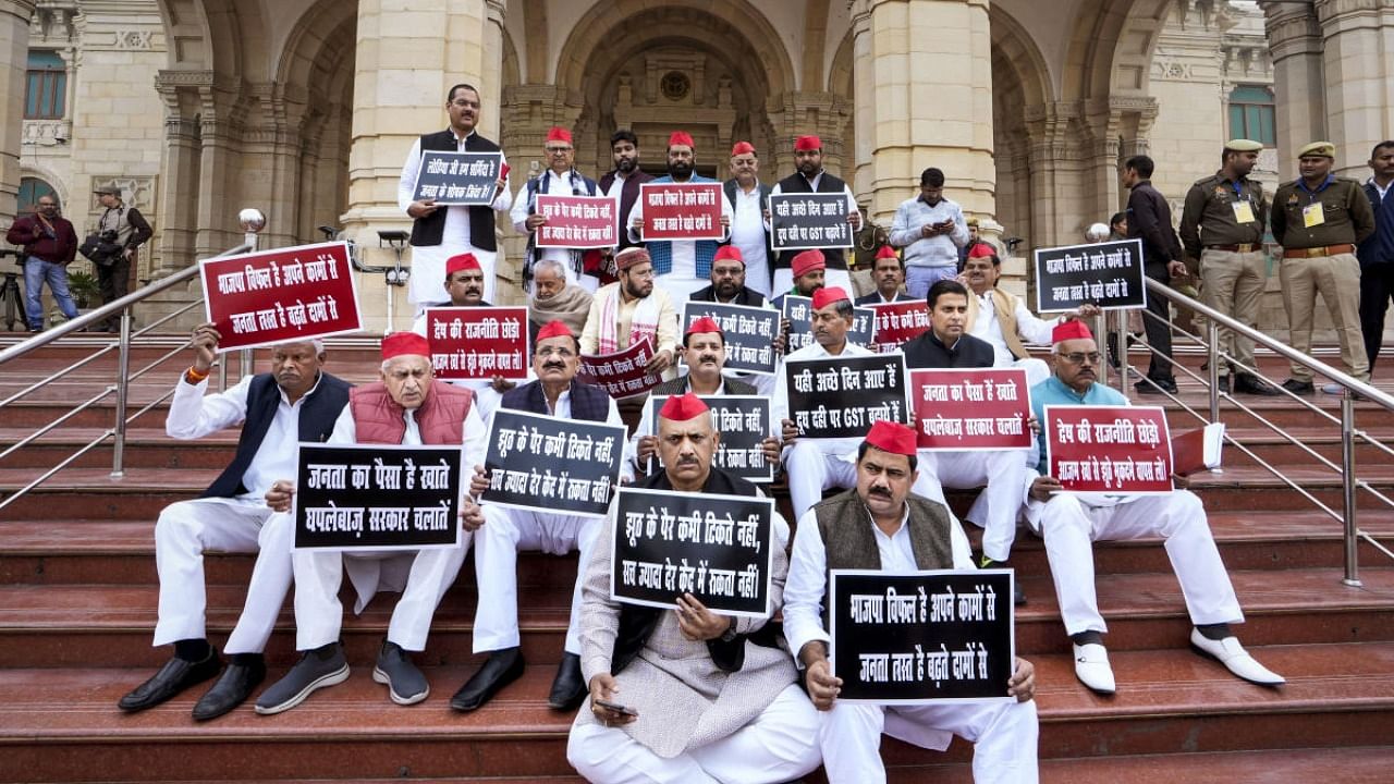 Samajwadi Party leaders stage a protest during the Winter Session of Uttar Pradesh Assembly, in Lucknow, Monday. Credit: PTI Photo
