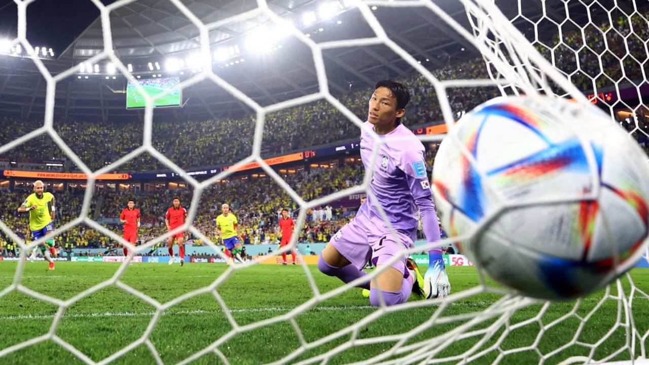 Brazil's Neymar scores their second goal from the penalty spot past South Korea's Kim Seung-gyu. Credit: Reuters Photo