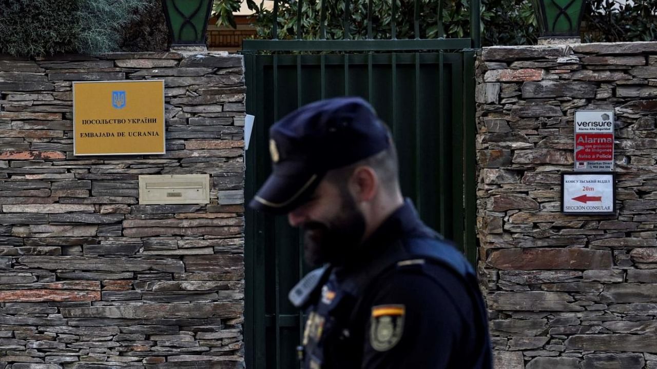 A Spanish policeman stands next to Ukraine's embassy in Madrid. Credit: AFP Photo