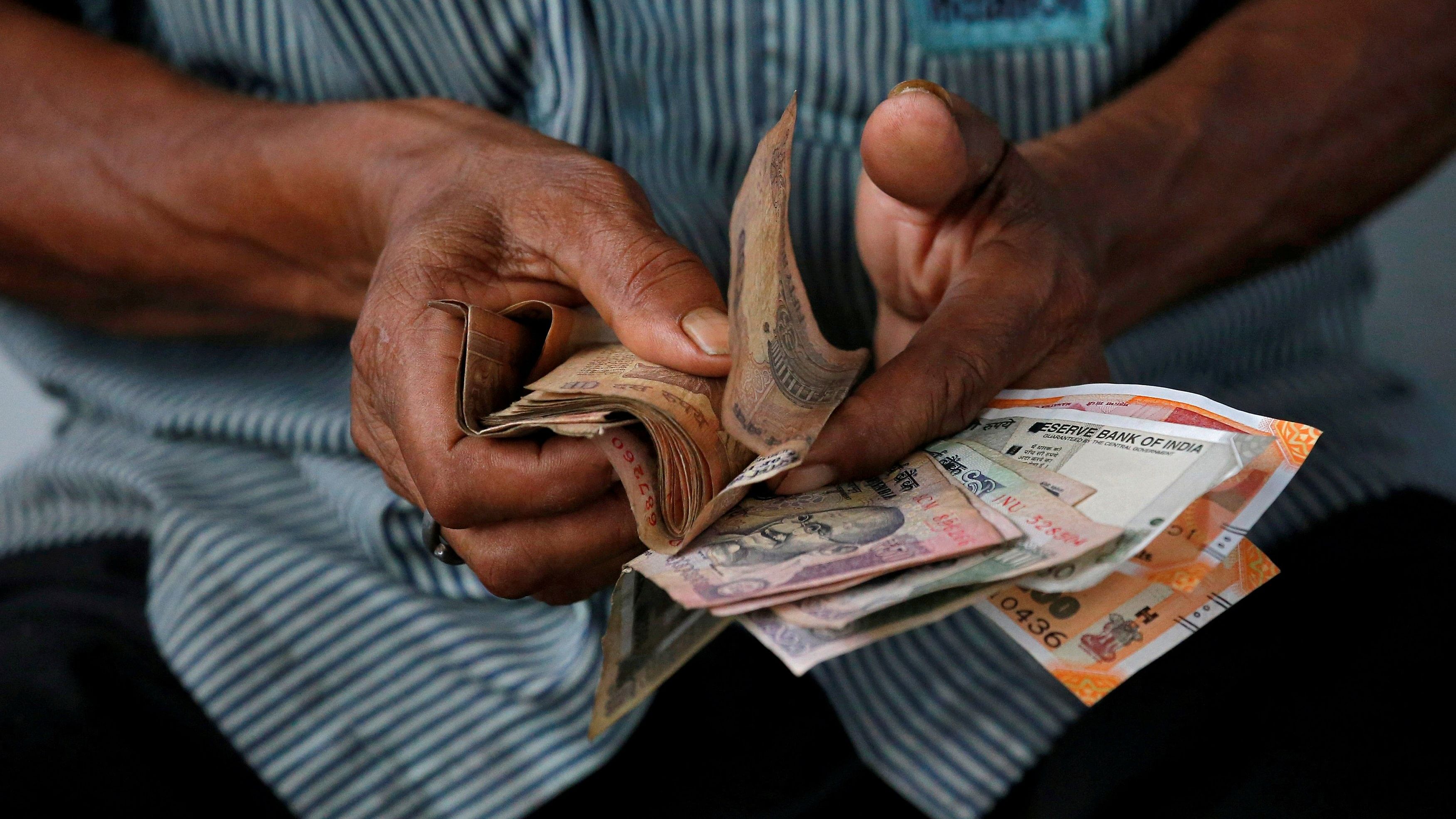 On Tuesday, the rupee declined by 65 paise to close at an over one-month low of 82.50 against the US dollar. Credit: Reuters Photo