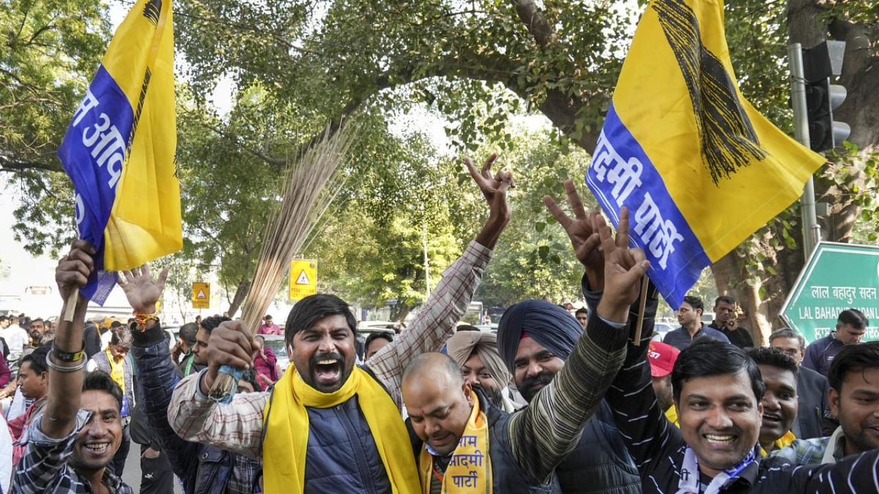 AAP supporters celebrate Delhi MCD election results outside a counting centre. Credit: PTI Photo