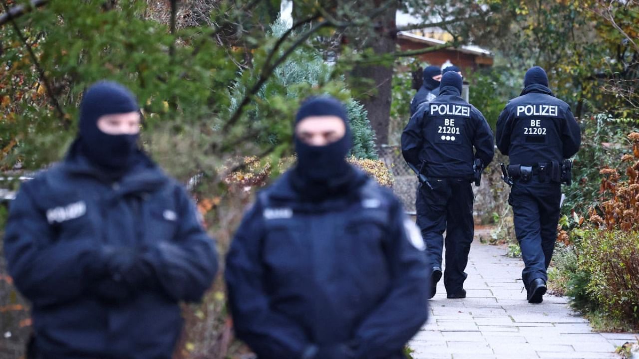 Police secures the area after 25 suspected members and supporters of a far-right group were detained during raids across Germany, in Berlin. Credit: Reuters photo
