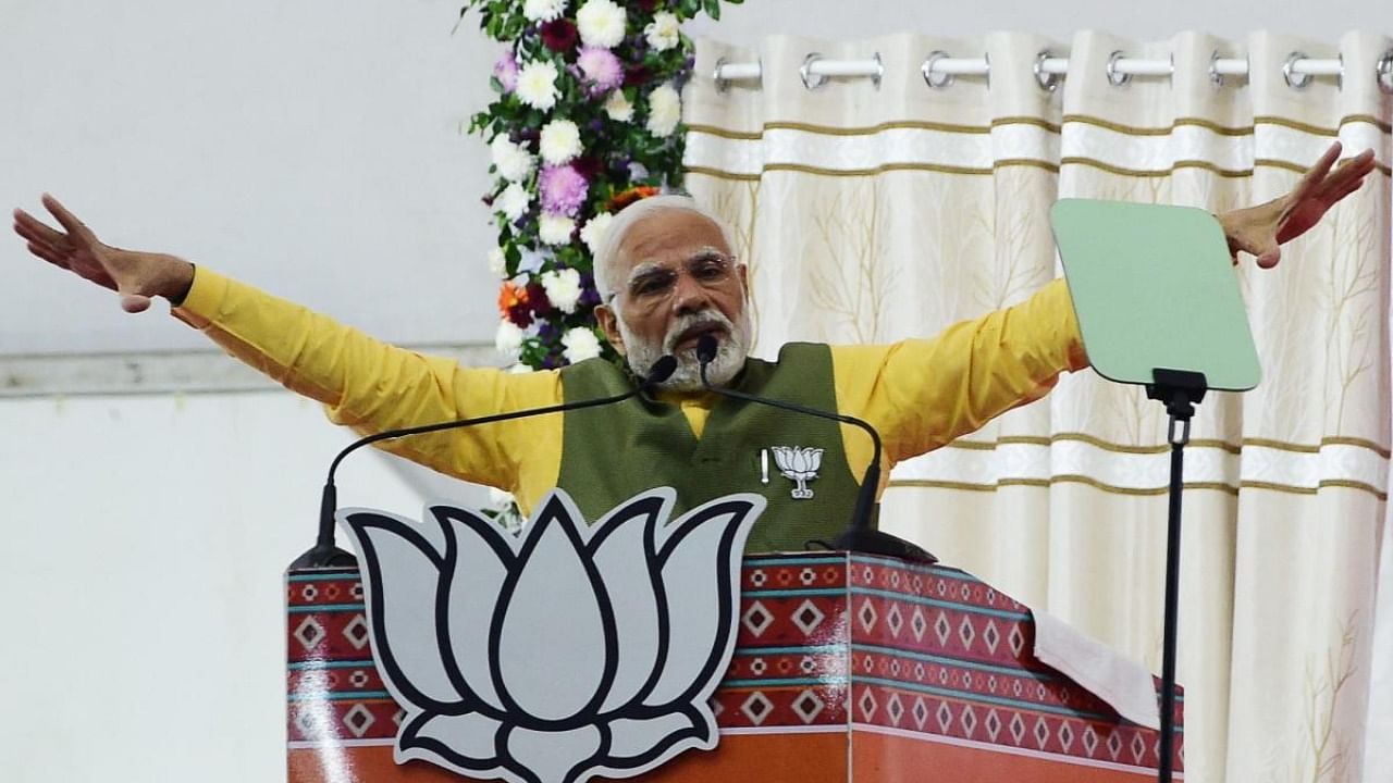 Prime Minister Narendra Modi gestures as he speaks during a Bhartiya Janta Party (BJP) rally ahead of 2nd phase of Gujarat's Assembly election, in Ahmedabad. Credit: AFP Photo