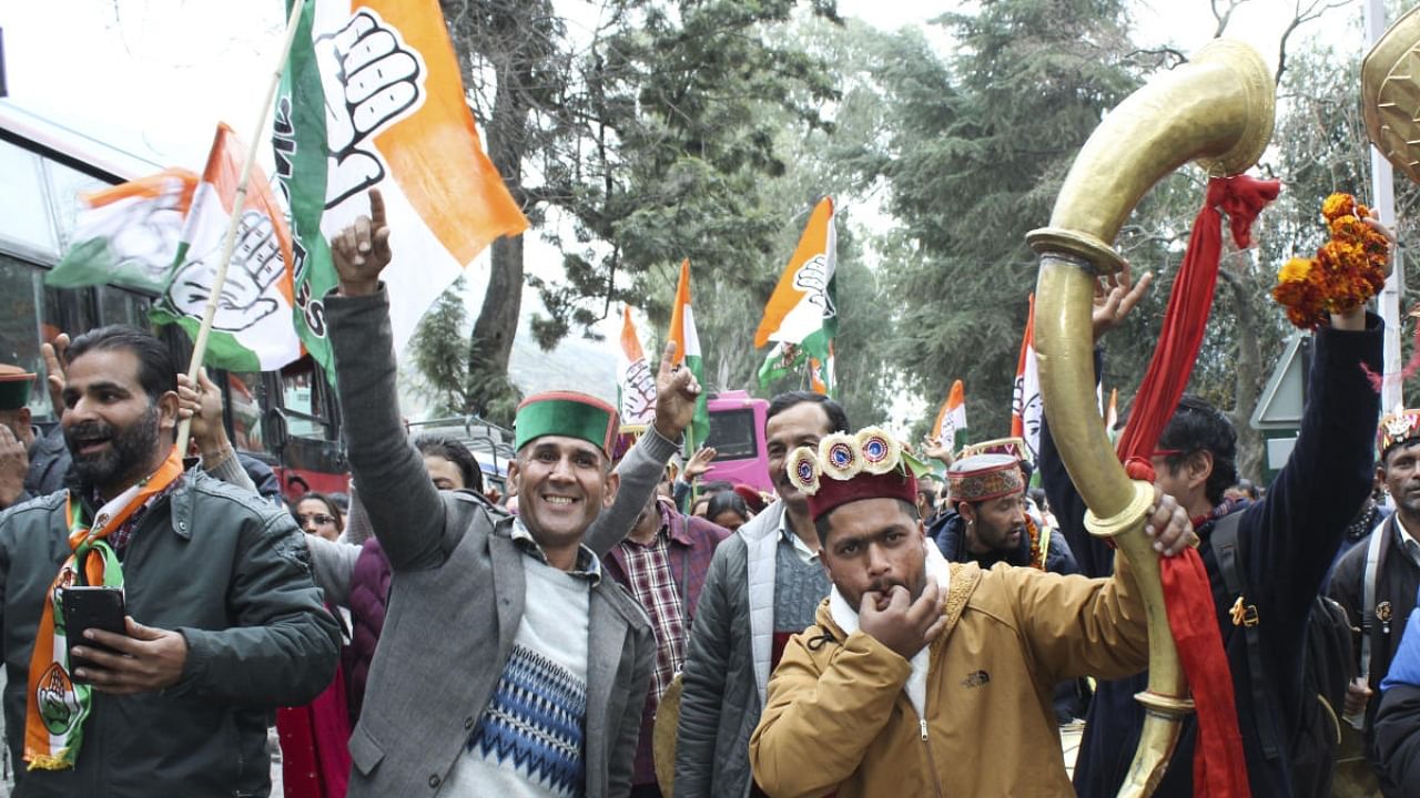 Congress workers celebrates the party's victory in Himachal Pradesh Assembly elections. Credit: PTI Photo