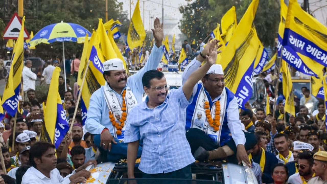 Delhi Chief Minister Arvind Kejriwal during a roadshow ahead of Gujarat Assembly elections. Credit: PTI Photo