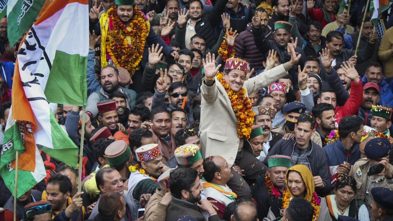 Congress candidate Sunder Singh Thakur with supporters celebrates his win in the Himachal Pradesh Assembly elections, in Kullu, Thursday, Dec. 8, 2022. Credit: PTI Photo