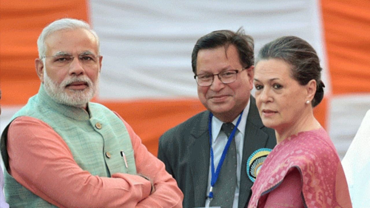 PM Modi and Congress leader Sonia Gandhi. Credit: AP Photo