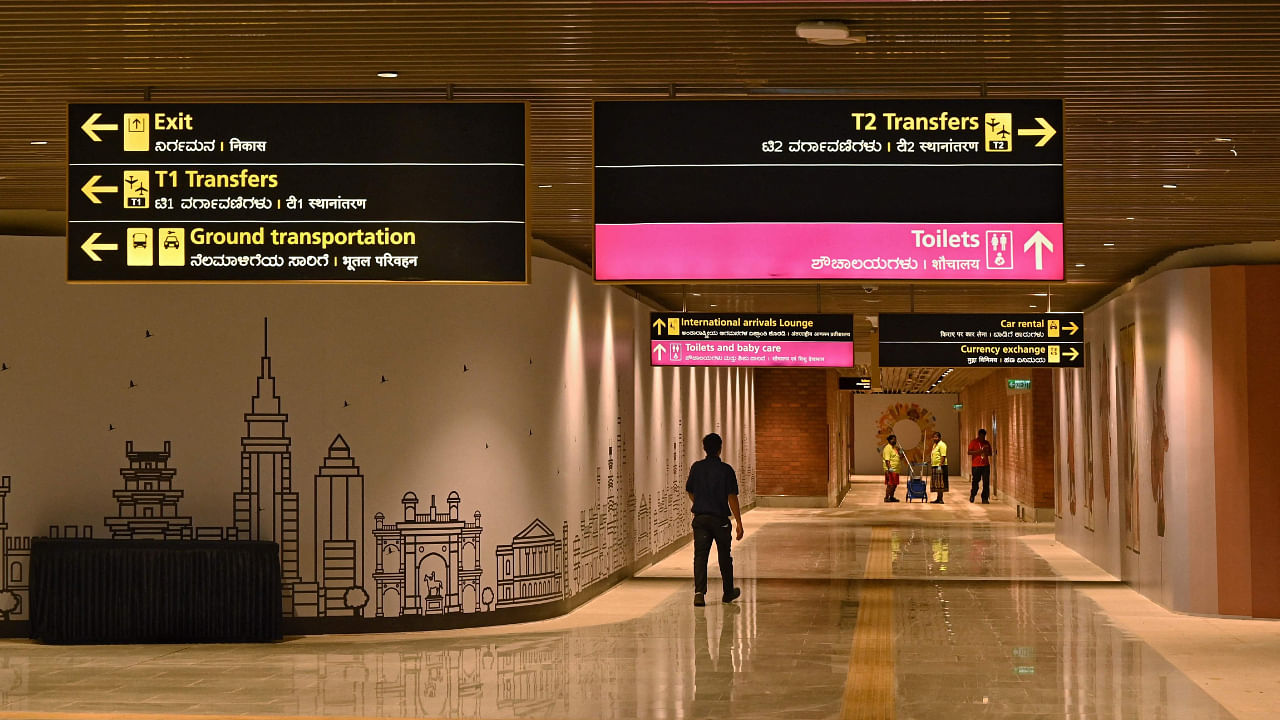 Employees walk inside the newly inaugurated Terminal 2 (T2) at the Kempegowda International Airport (KIA) in Bengaluru . Credit: AFP Photo