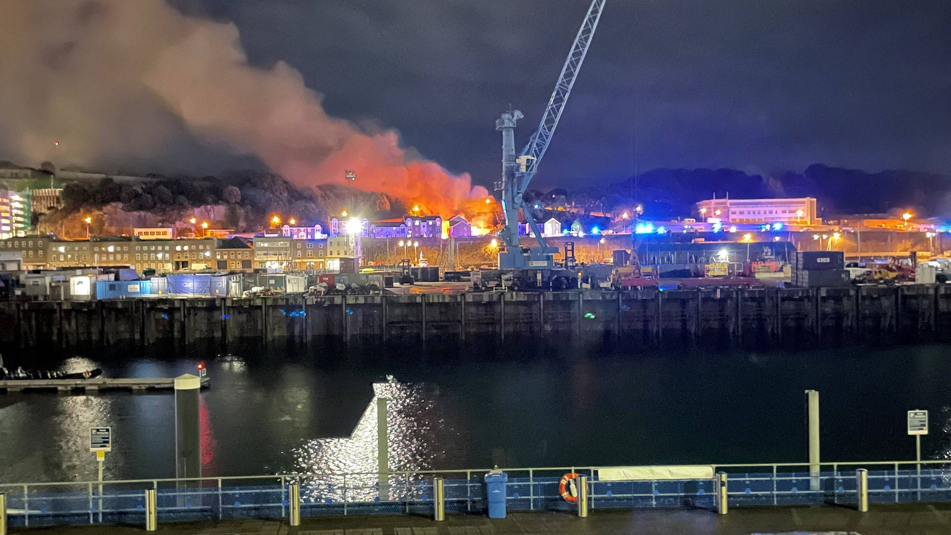 A general view of fire and smoke in Saint Helier following an explosion on the island of Jersey. Credit: Daniel Hunt via Reuters