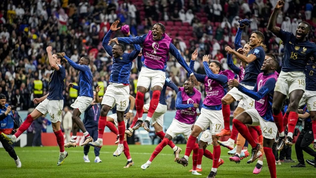 France players celebrate their team victory over England at the end of the World Cup quarterfinal soccer match. Credit: AP Photo
