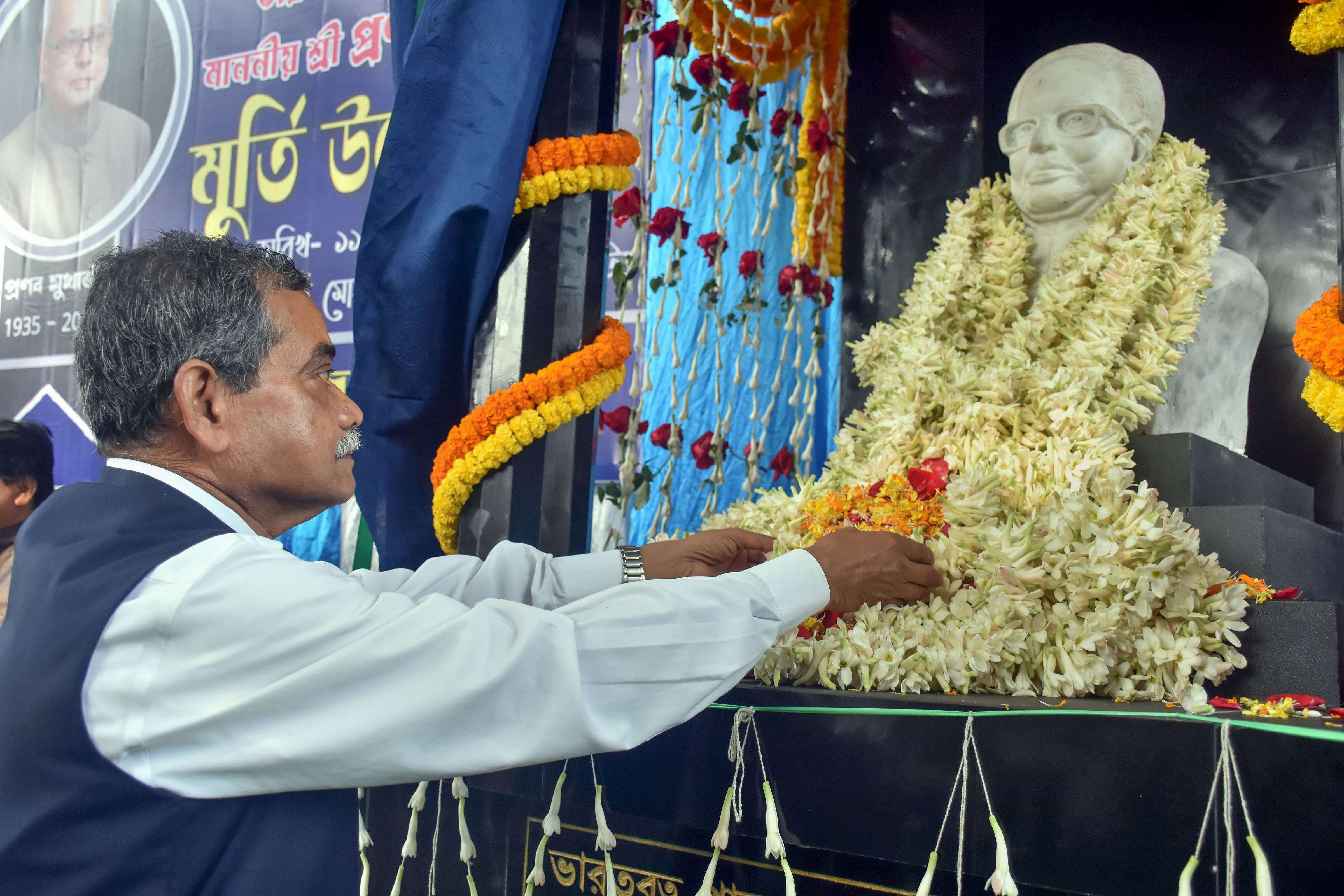 Former MP Abhijit Mukherjee pays homage to his father and former president Pranab Mukherjee. Credit: PTI Photos