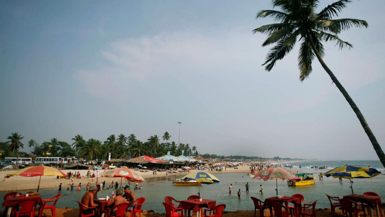File photo of tourists relaxing at Goa's Baga beach. Credit: PTI Photo