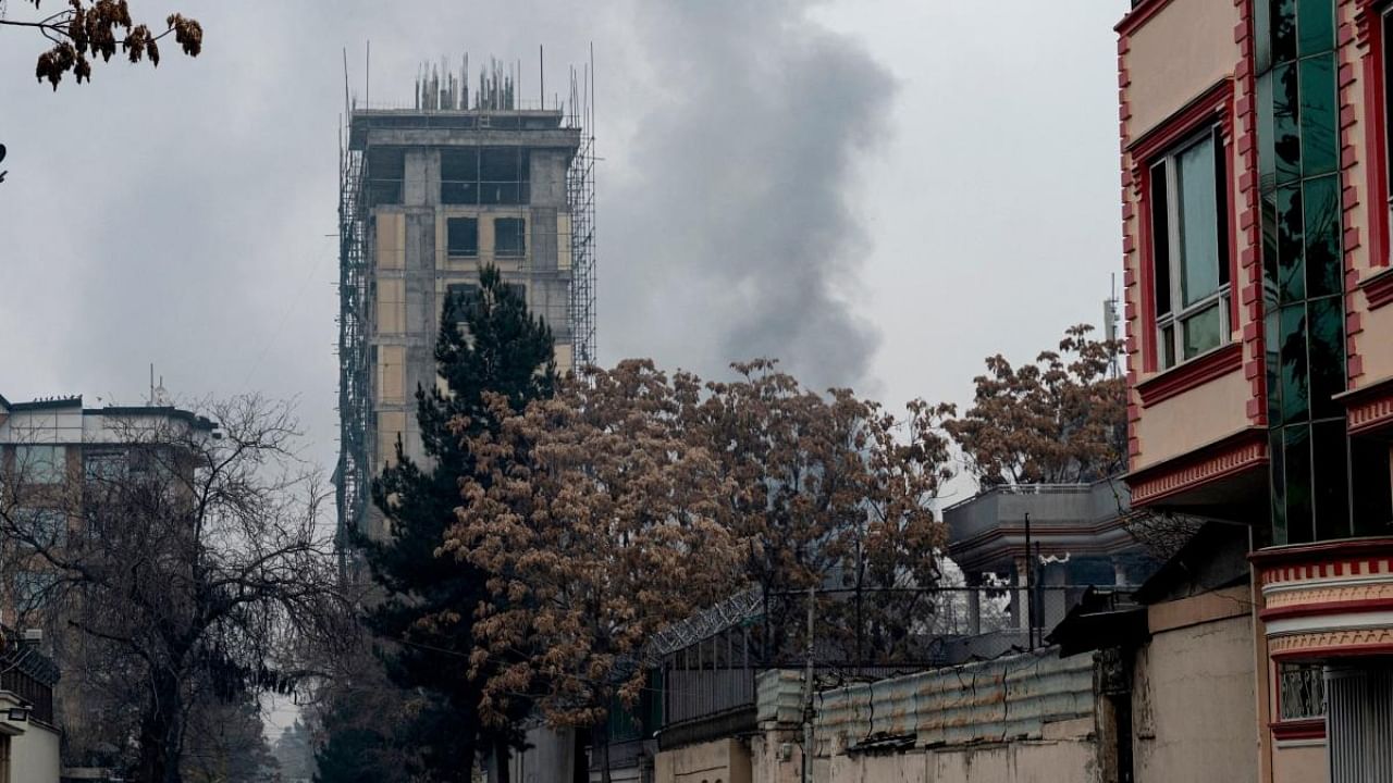 Smoke rises from a site of an attack at Shahr-e-naw which is city's one of main commercial areas in Kabul. Credit: AFP Photo