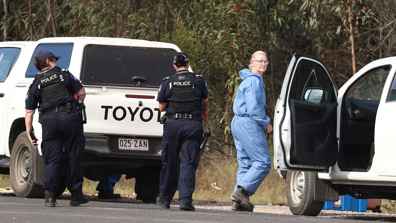 Police work near the scene of a fatal shooting, where police shot multiple people at a remote Queensland property after an ambush in which two officers and a bystander were also killed, in Wieambilla, Australia, December 13, 2022. Credit: Reuters Photo