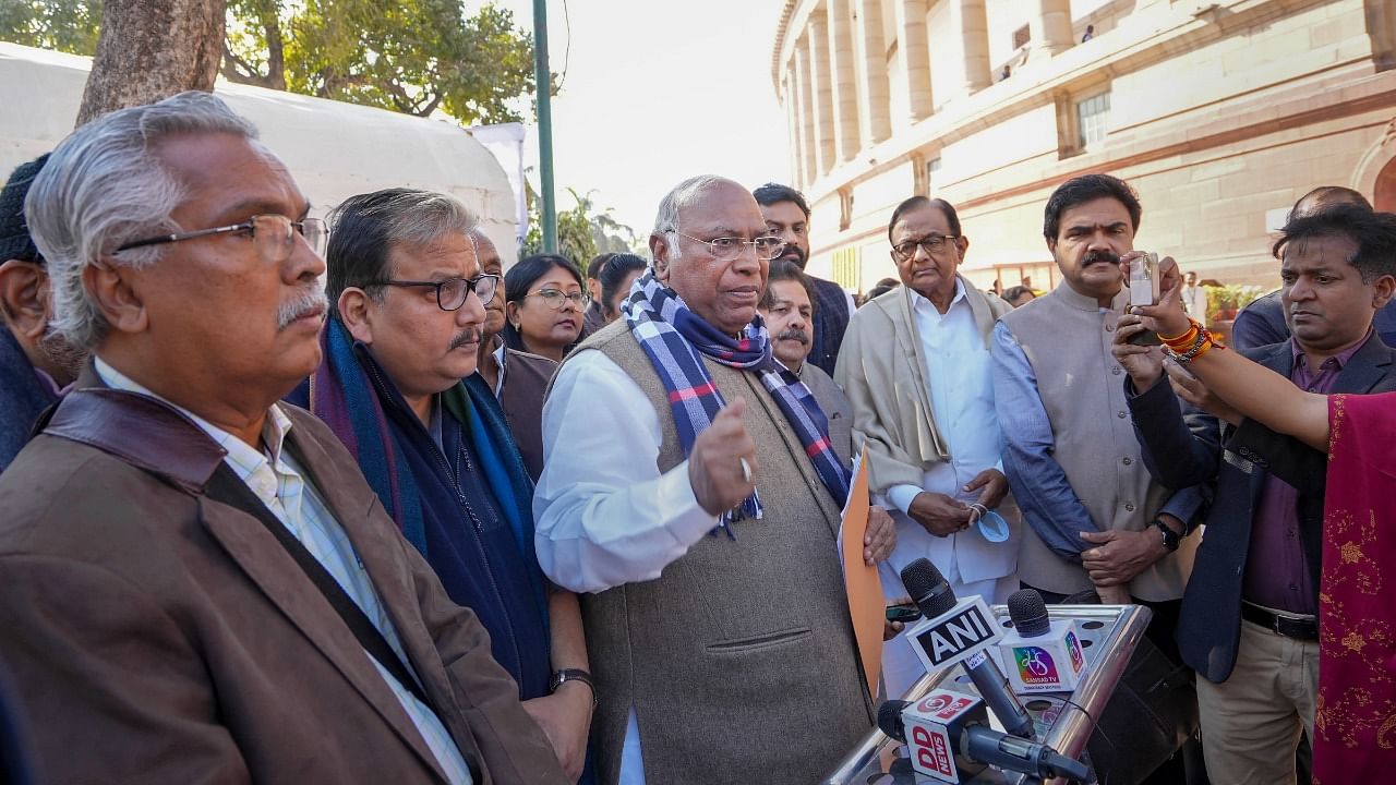 Congress MP Mallikarjun Kharge with Opposition leaders addresses the media at Parliament House complex after staging a walkout from Rajya Sabha during ongoing Winter Session. Credit: PTI Photo