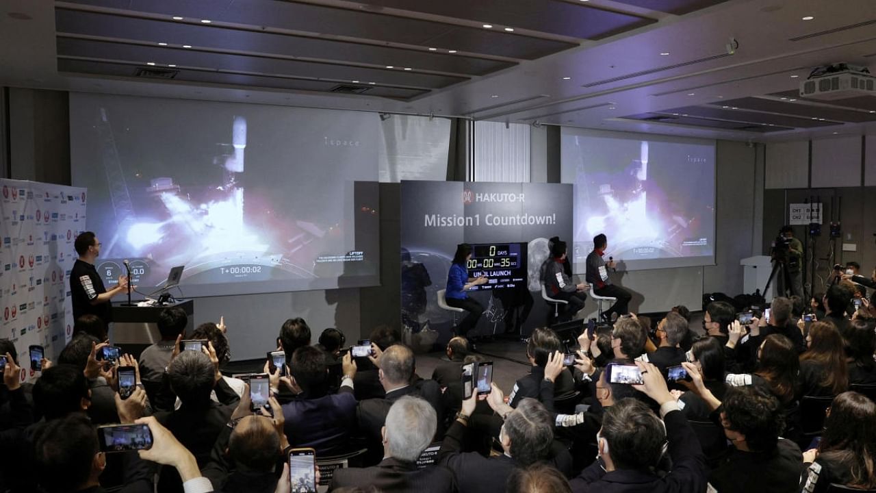 Officials of ispace Inc's HAKUTO-R mission look at live broadcasting of the launch of a SpaceX Falcon 9 rocket for ispace at Cape Canaveral Space Force Station, in Tokyo, Japan December 11, 2022. Credit: Reuters Photo