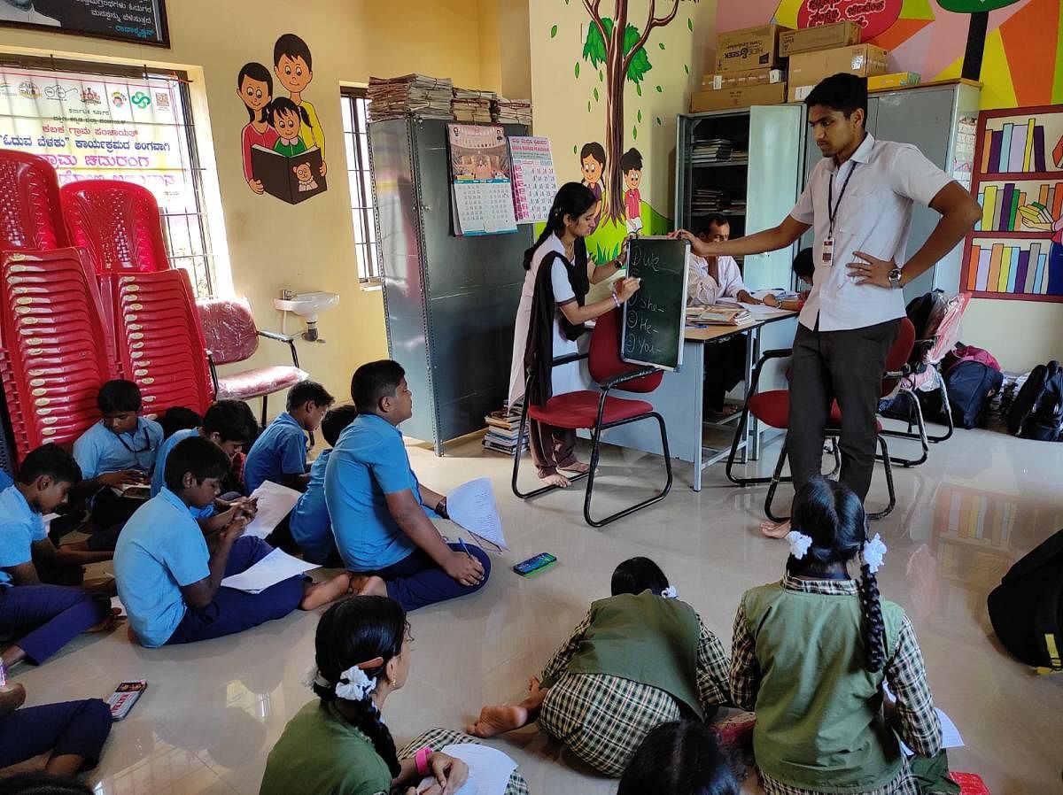 Students at the gram panchayat library in Karnataka. 