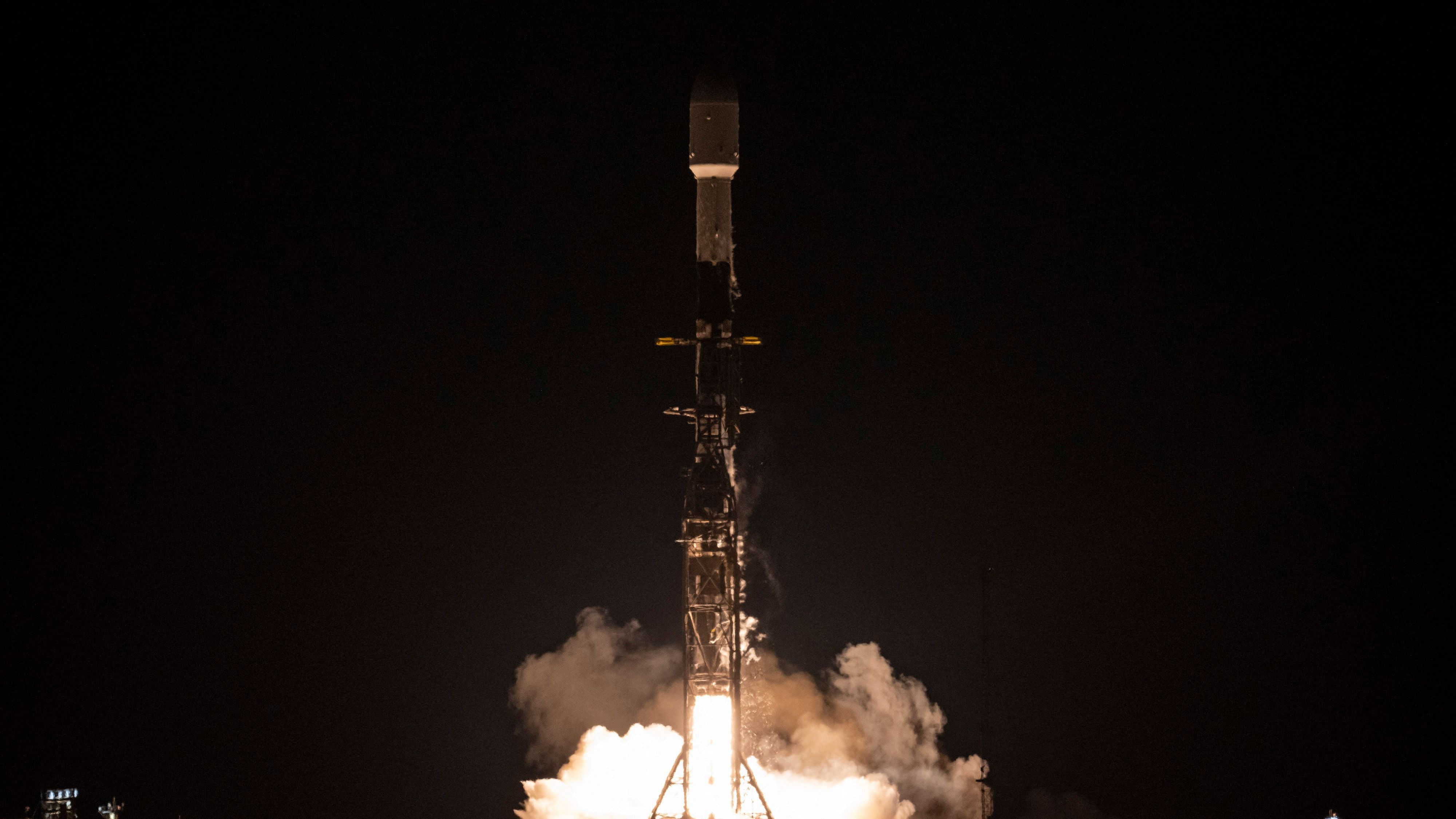 In this image released by NASA, a SpaceX Falcon 9 rocket with NASA's Surface Water and Ocean Topography (SWOT) satellite lifts off from Vandenberg Air Force Base. Credit: AFP Photo / NASA / Keegan Barber