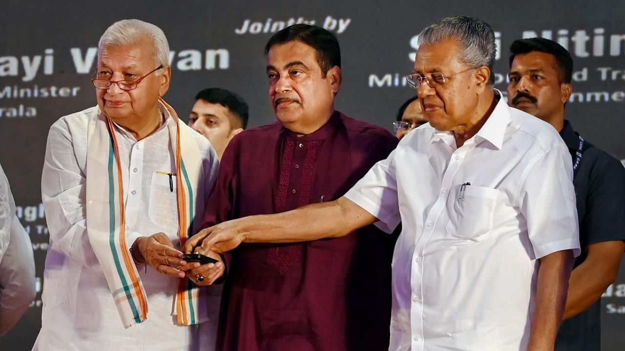 Governor of Kerala Arif Mohammad Khan, Union Minister for Road, Transport and Highways Nitin Gadkari (C) and Kerala Chief Minister Pinarayi Vijayan (R) during the inaugural of the Kazhakoottam elevated highway and the foundation stone laying ceremony of various NH 66 road projects, in Thiruvananthapuram. Credit: PTI Photo