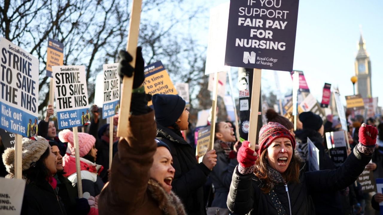 NHS nurses chant slogans during a strike, amid a dispute with the government over pay, outside St Thomas' Hospital in London. Credit: Reuters Photo
