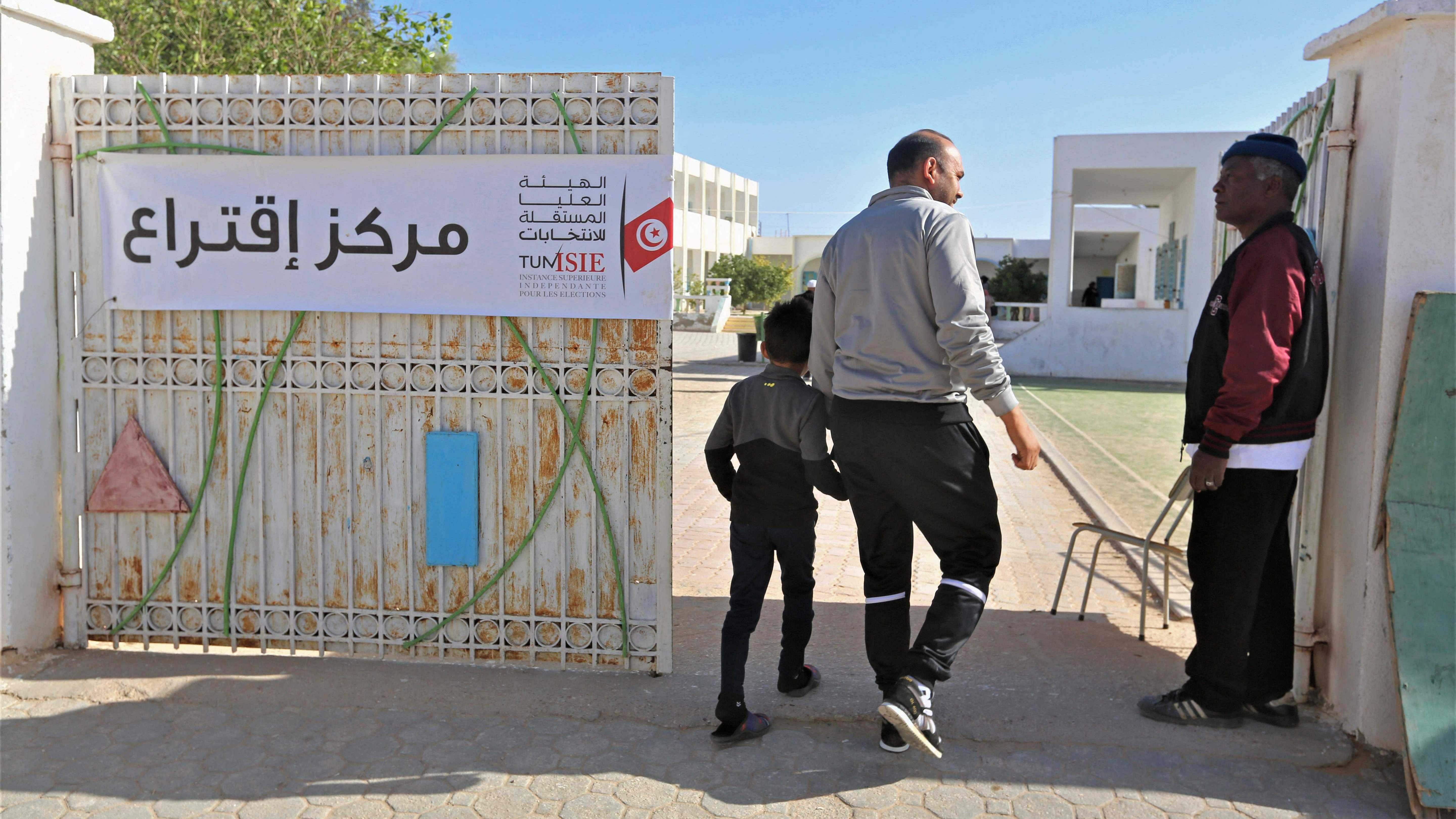 A Tunisian voter leaves a polling station in Tunisia's southern town of Ben Guerdane. Credit: AFP Photo