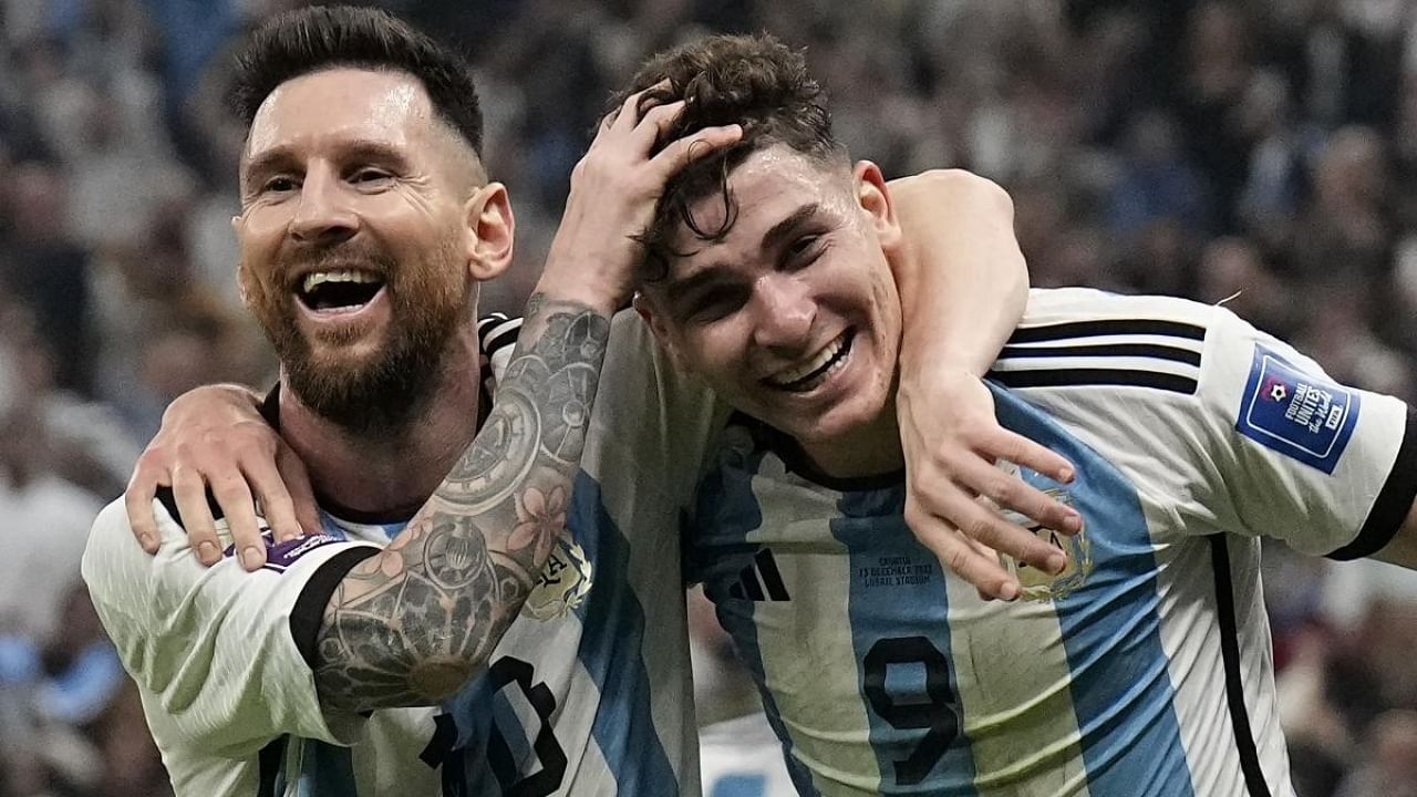 Argentina's Julian Alvarez (right) celebrates with Lionel Messi (left). Credit: AP/PTI Photo