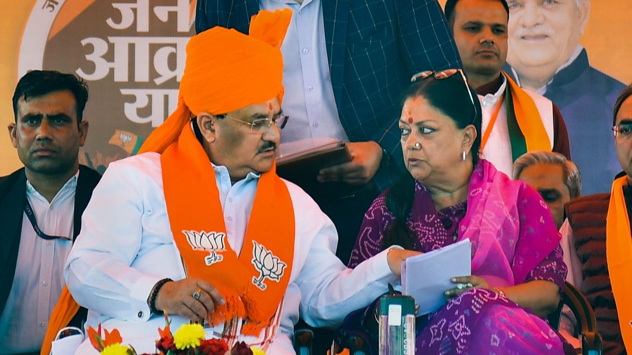 BJP National President JP Nadda with former Rajasthan chief minister Vasundhara Raje during the party's 'Jan Aakrosh Yatra’, in Jaipur, Thursday, Dec. 01, 2022. Credit: PTI Photo