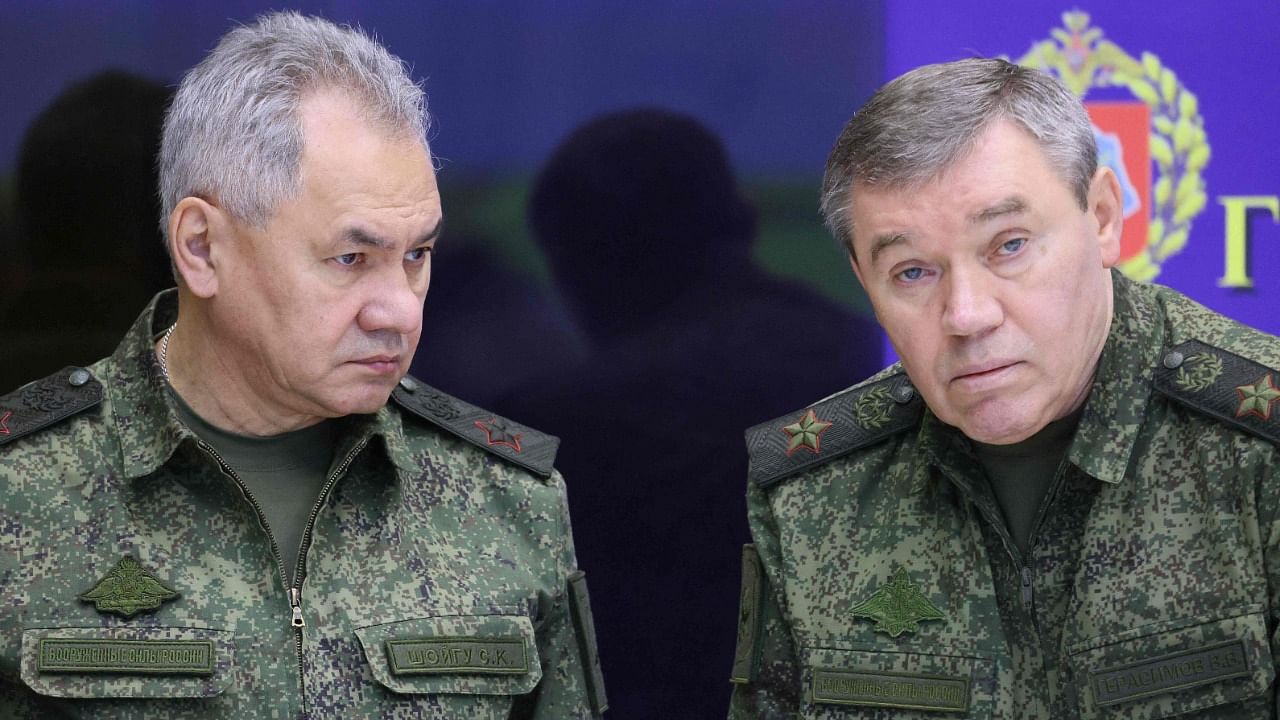 Russian Defence Minister Sergei Shoigu (L) and chief of the Russian General Staff Valery Gerasimov (R) are seen during a visit of Russian President to the joint staff of troops involved in Russia's military operation in Ukraine in an undisclosed place. Credit: Gavriil GRIGOROV / Sputnik / AFP