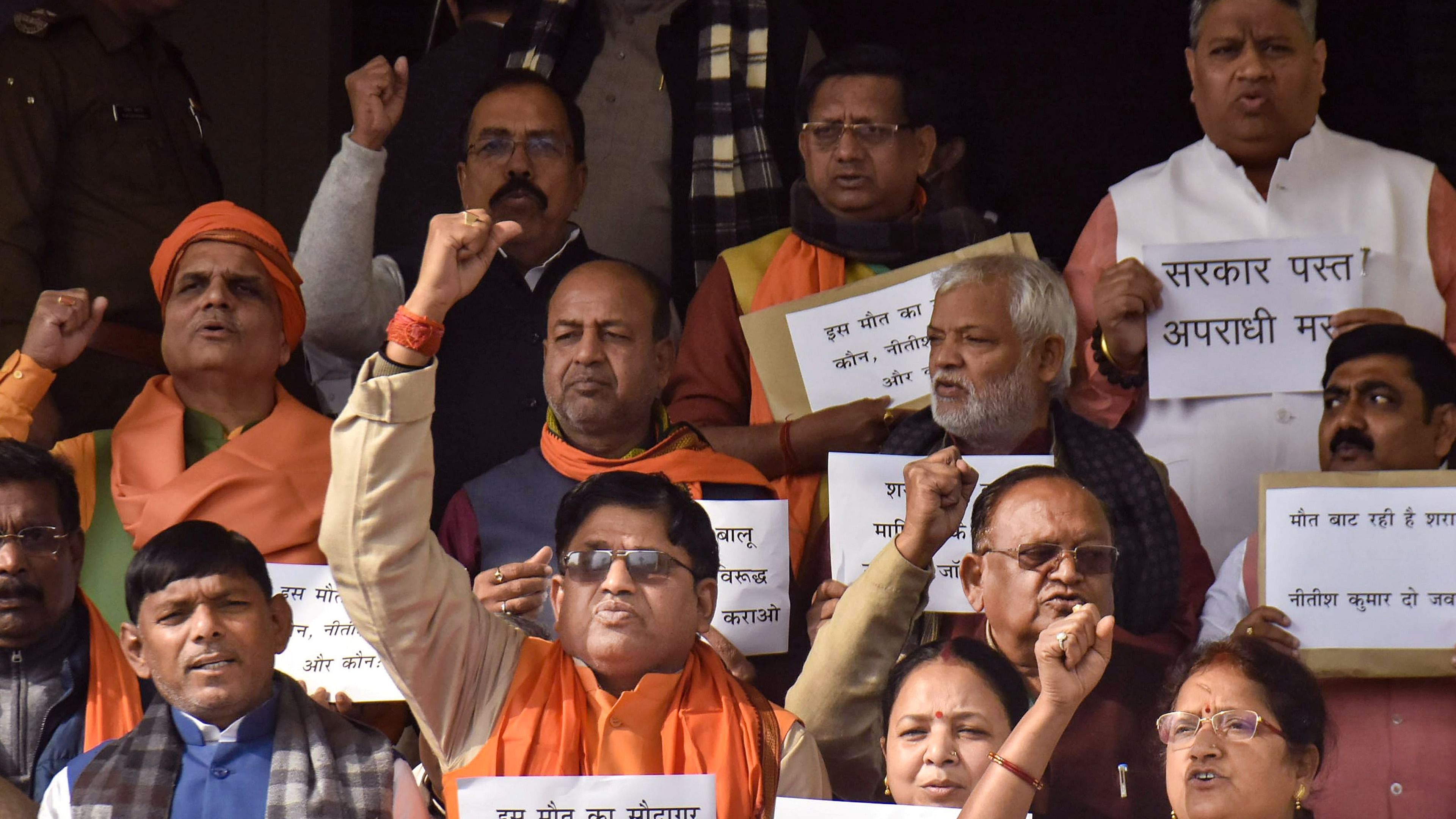 Bharatiya Janata Party legislators stage a protest over Saran hooch tragedy, during the Winter Session of the state Assembly. Credit: PTI Photo