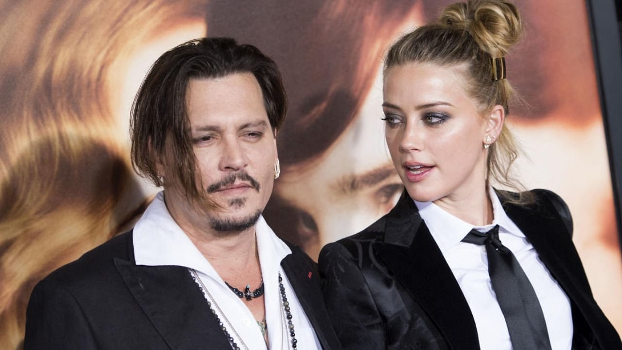 File photo of actors Johnny Depp and Amber Heard. Credit: AFP