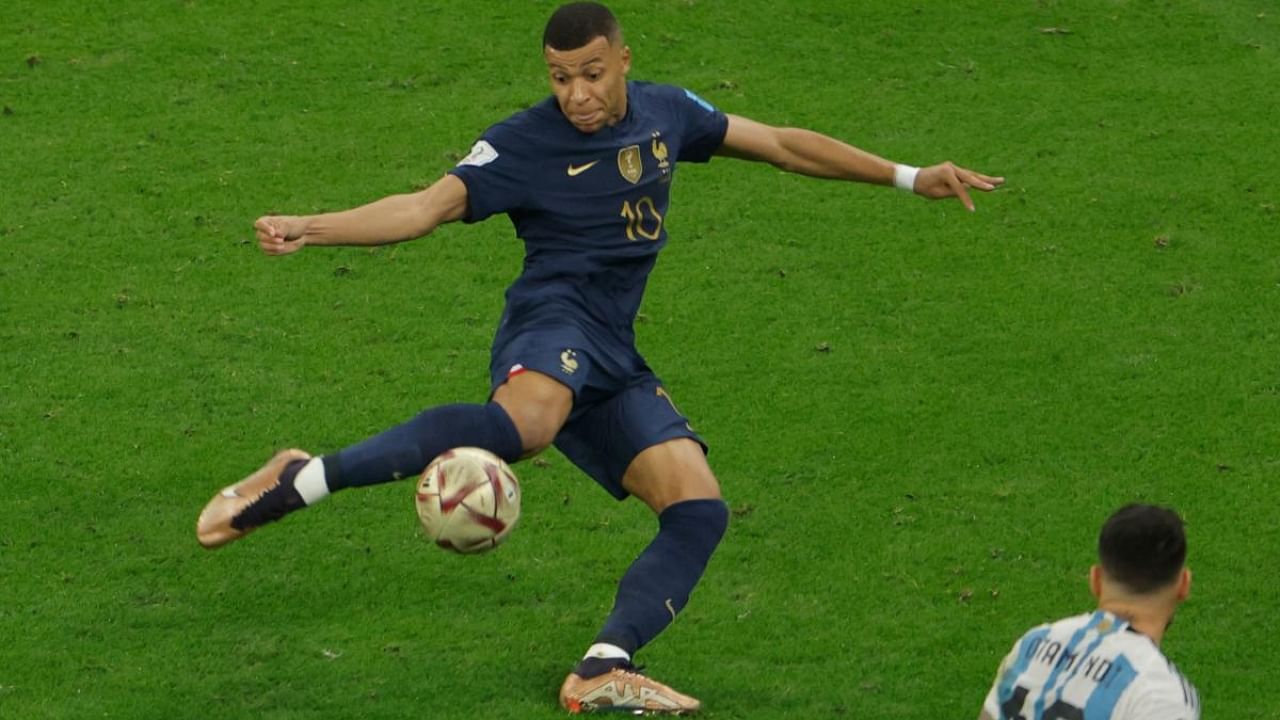 Kylian Mbappe strikes the ball to score France's second goal in the 2022 World Cup final, a tournament where the Frenchman netted a total of eight. Credit: AFP Photo