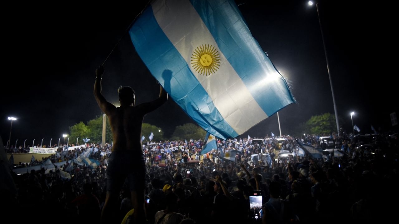 Fans in Buenos Aires celebrate after winning the World Cup. Credit: Reuters Photo