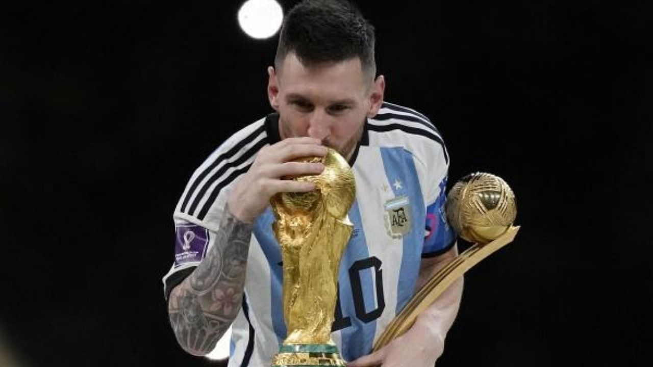 Argentina's Lionel Messi kisses the trophy after winning the World Cup final. Credit: AP/PTI Photo