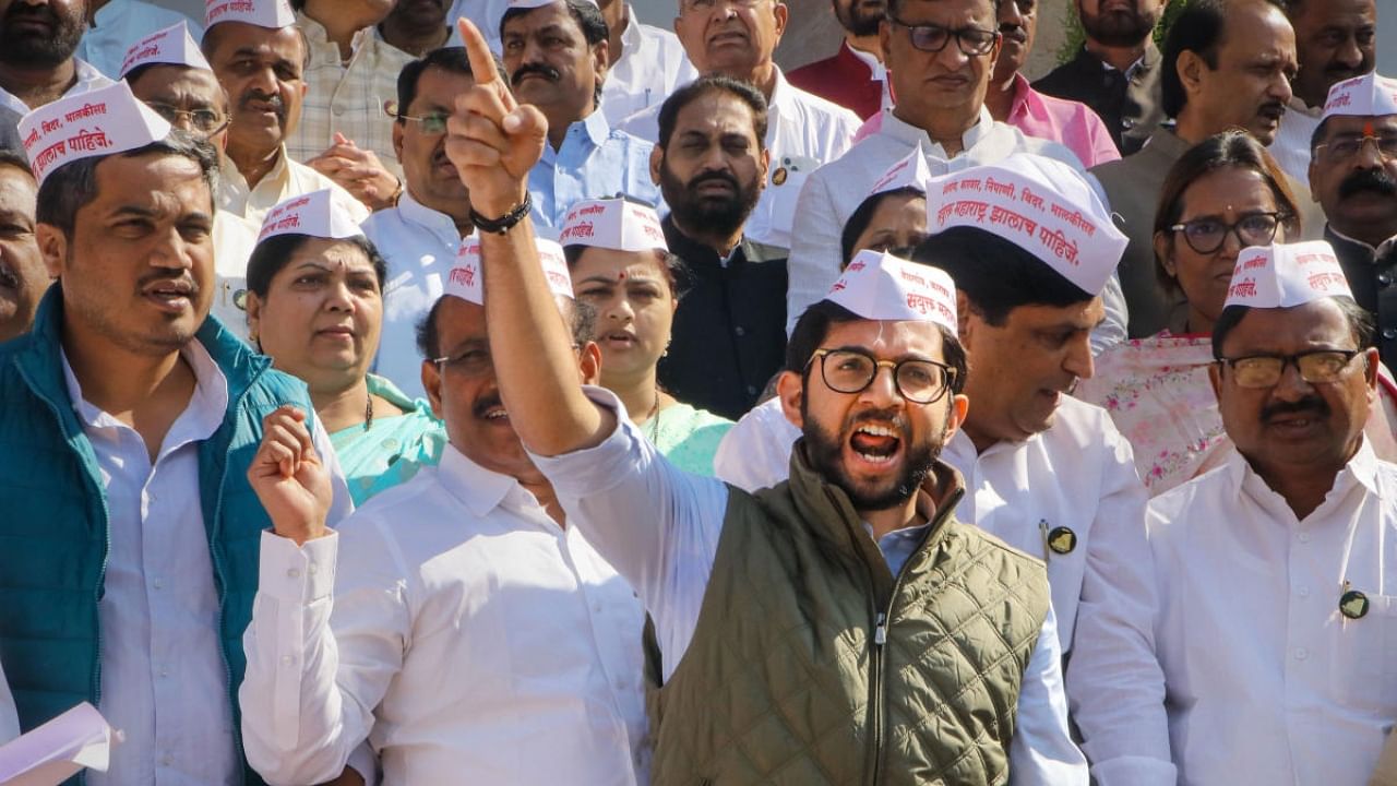 Maha Vikas Aghadi (MVA) MLAs raise slogans during a protest against the state government. Credit: PTI Photo