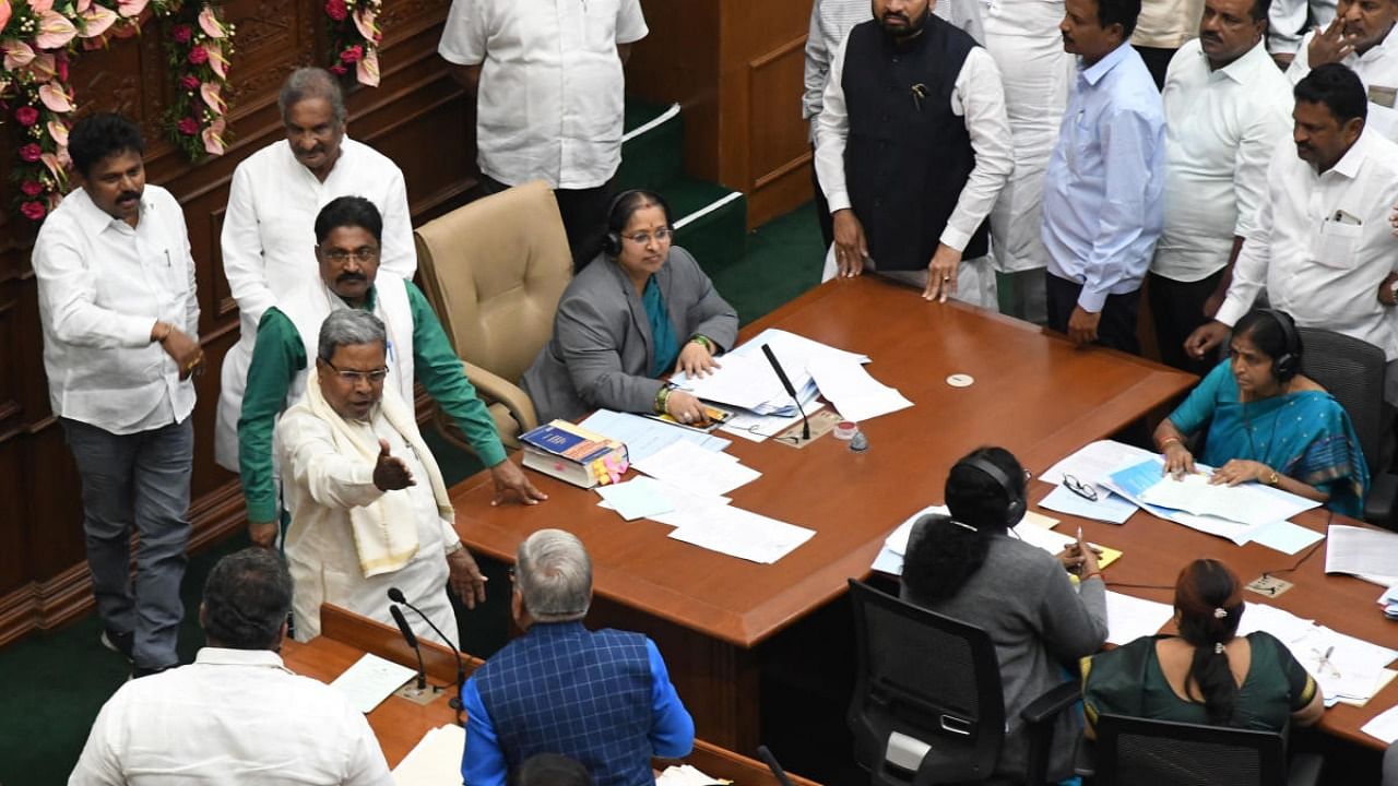 Leader of Opposition Siddaramaiah and Minister Govind Karjol exchange words during the legislature session in Suvarna Vidhana Soudha on Wednesday. Credit: DH Photo