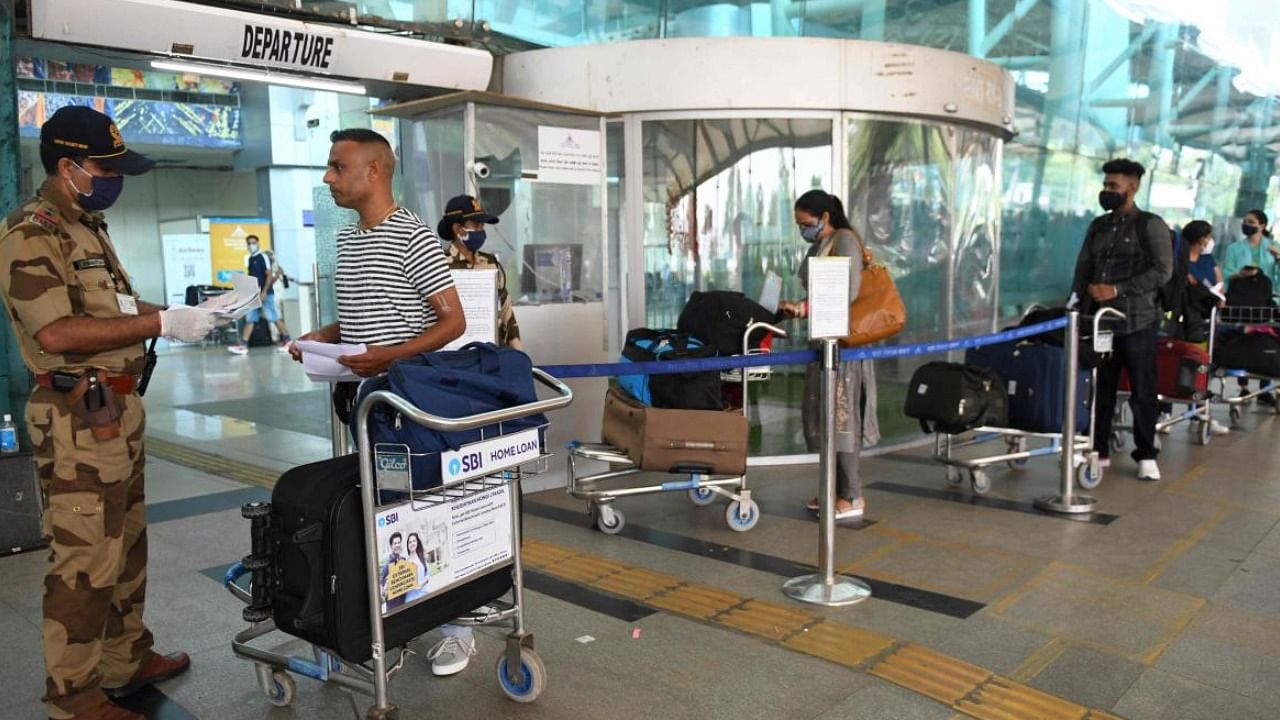 A security personnel checks the ticket of a passenger at Amritsar airport. Credit: PTI 