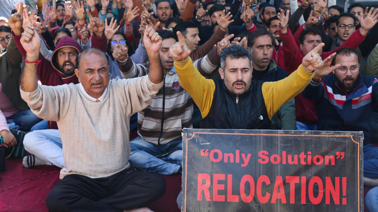 Kashmiri Pandits, working under PM's Development Package, raise slogans during a protest demanding their relocation, in Jammu. Credit: PTI File Photo