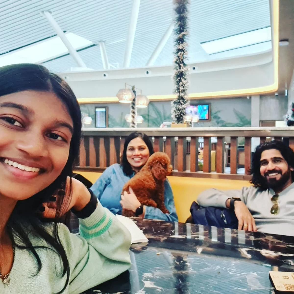 Sachin Shenoy with his wife Uma and daughter Aaryaa (extreme left) and pet Fluffy at the Bengaluru airport lounge on December 17, when pet boarding was denied at the last minute.