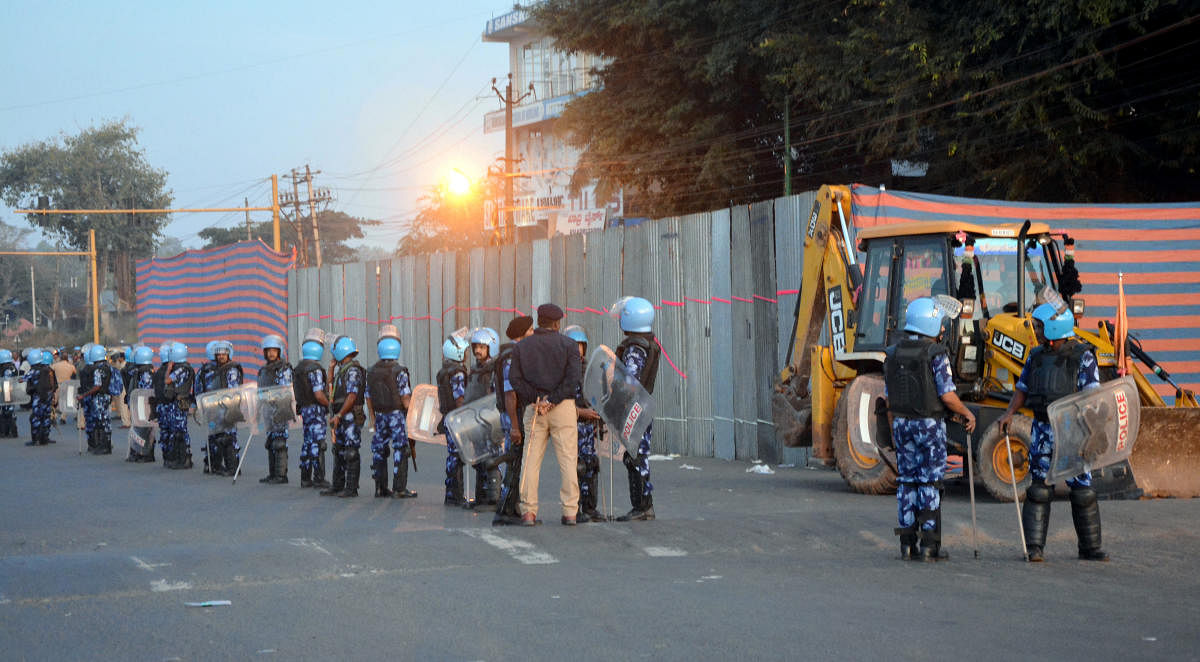 The personnel from Rapid Action Force are deployed during the partial demolition of dargah in Hubballi on Wednesday. Credit: DH Photo