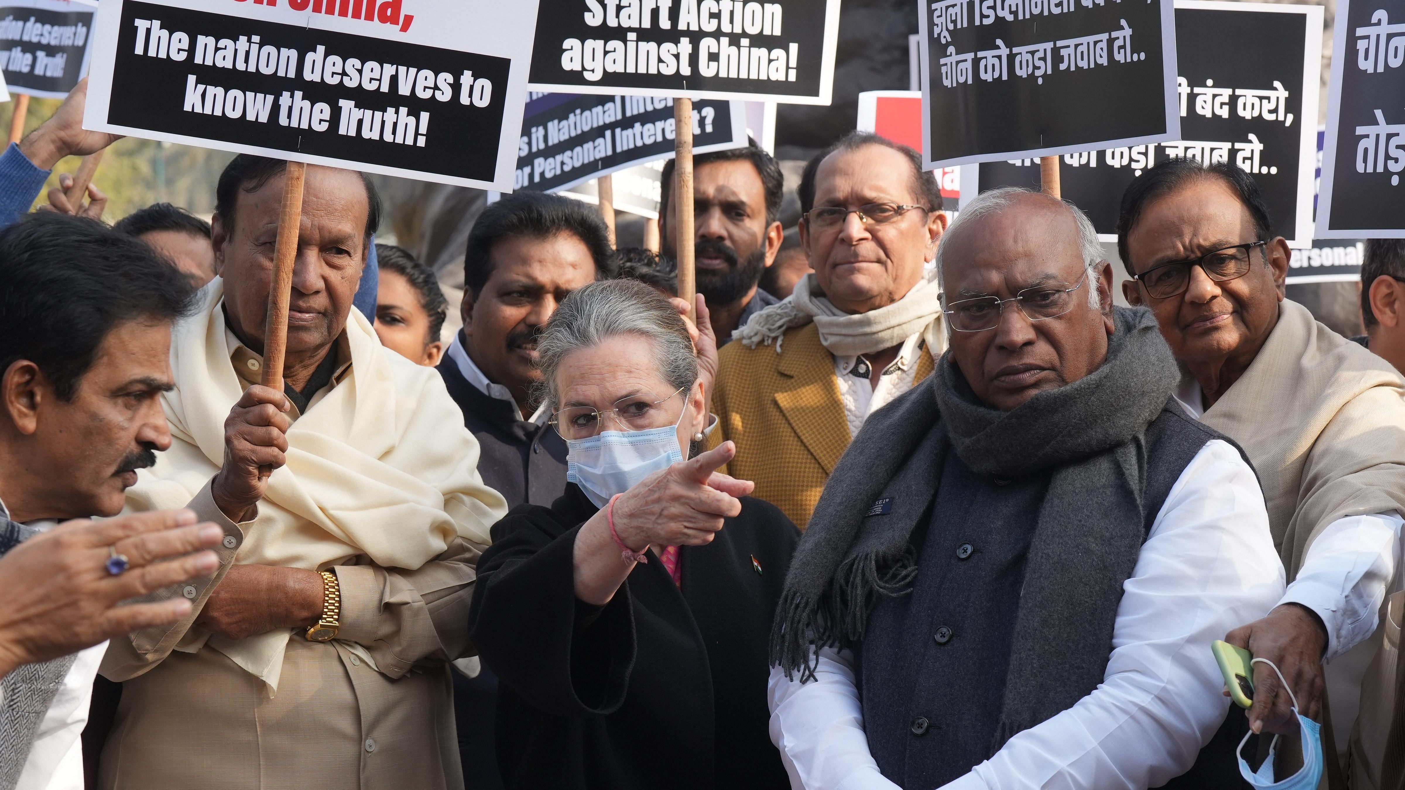 Congress MPs Mallikarjun Kharge, Sonia Gandhi, P Chidambaram, KC Venugopal, DMK's TR Baalu and other members stage a protest near the Gandhi Statue demanding discussion on national security and Indo-China border dispute issue during the Winter Session of Parliament, in New Delhi. Credit: PTI Photo